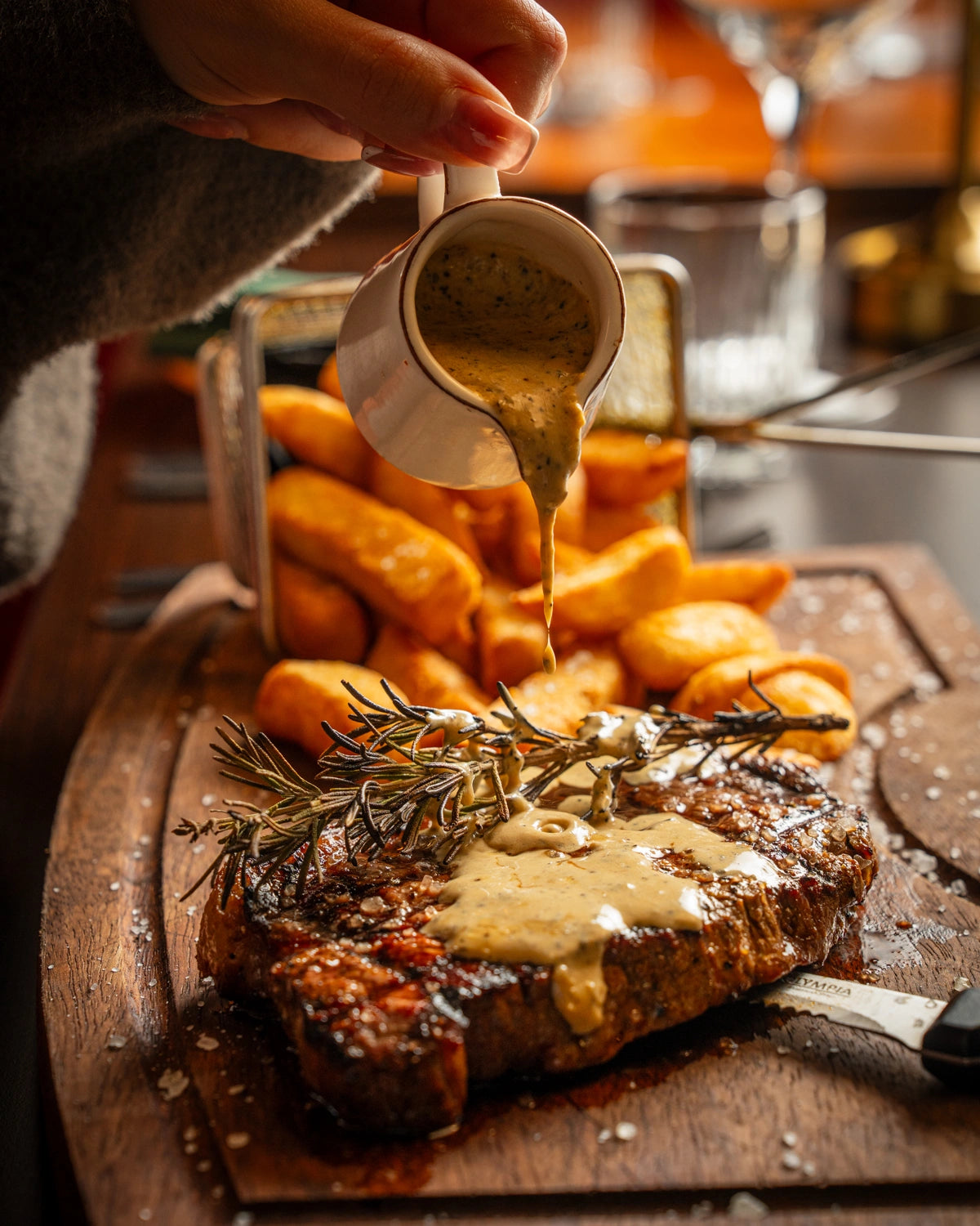 Grilled steak with peppercorn sauce and chips at LOSH Bar & Grill, Harpenden