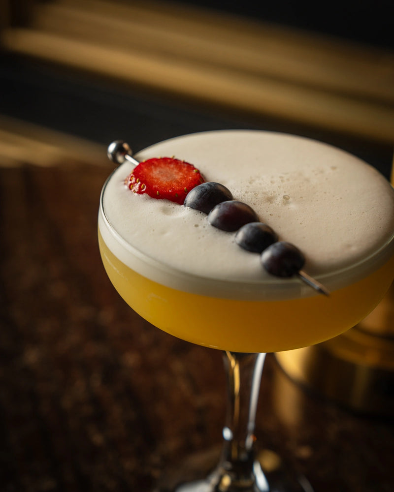 Strawberry and blueberry garnished cocktail served at LOSH Bar & Grill, Harpenden